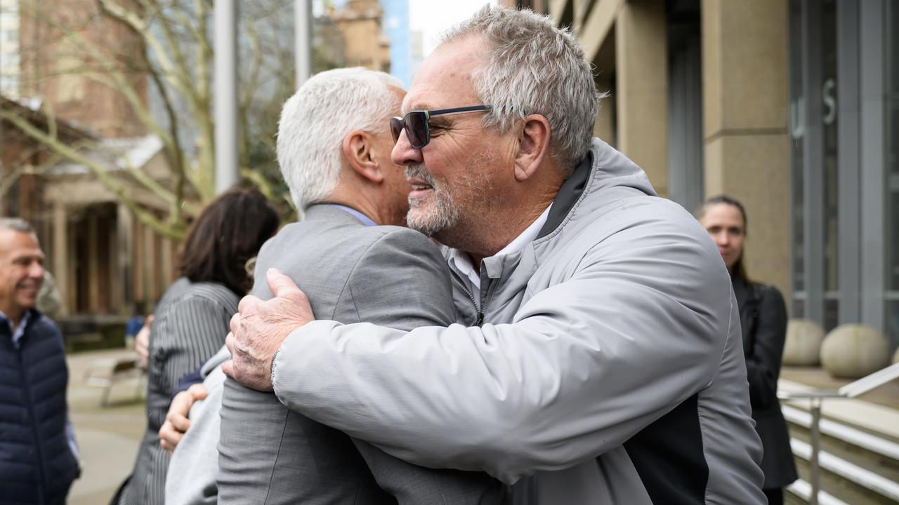 Michael Kaine and Don Dixon embrace outside court (file image)