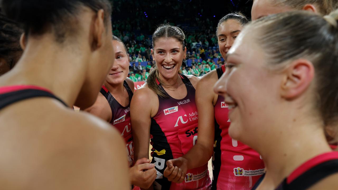 Adelaide Thunderbirds players celebrate.