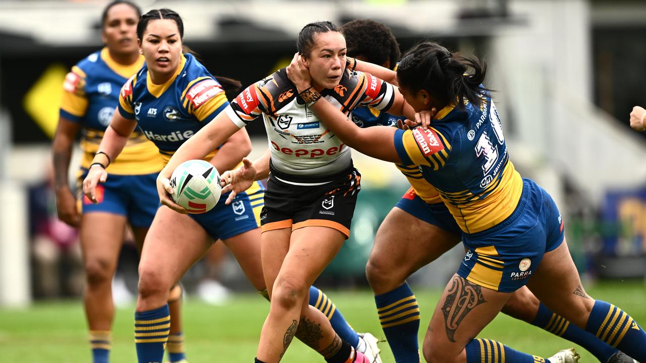 Raecene McGregor wrestles through tacklers 