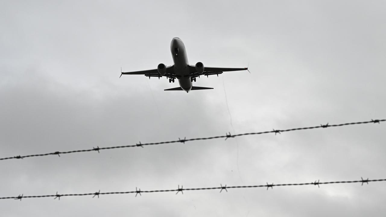 A plane lands at Melbourne Airport