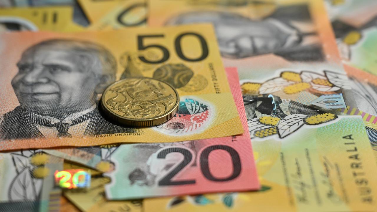 Australian fifty and twenty dollar notes and a dollar coin