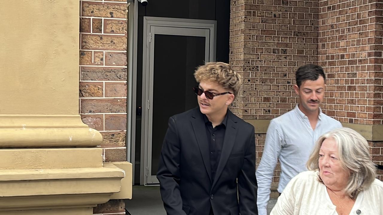 men walk out of court
