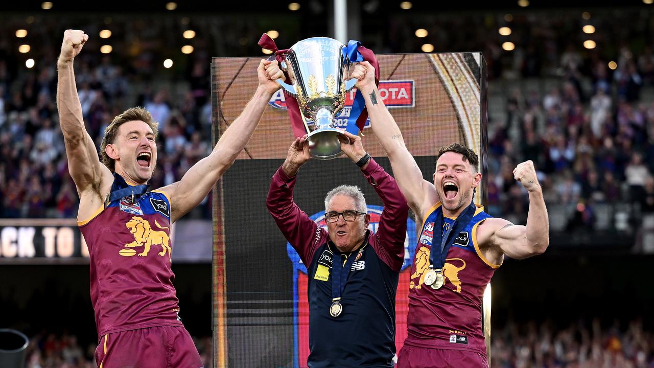 Harris Andrews, coach Chris Fagan and Lachie Neale