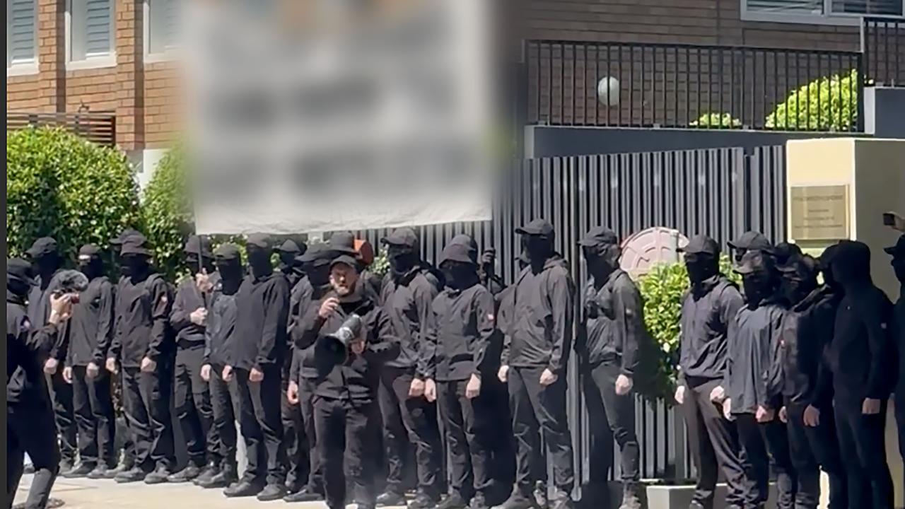 neo-Nazis with faces obscured outside Chinese consulate 