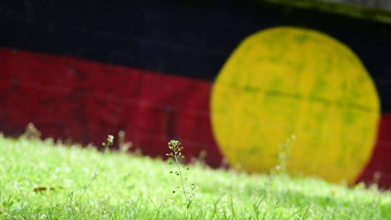 A wall painted with the Aboriginal flag