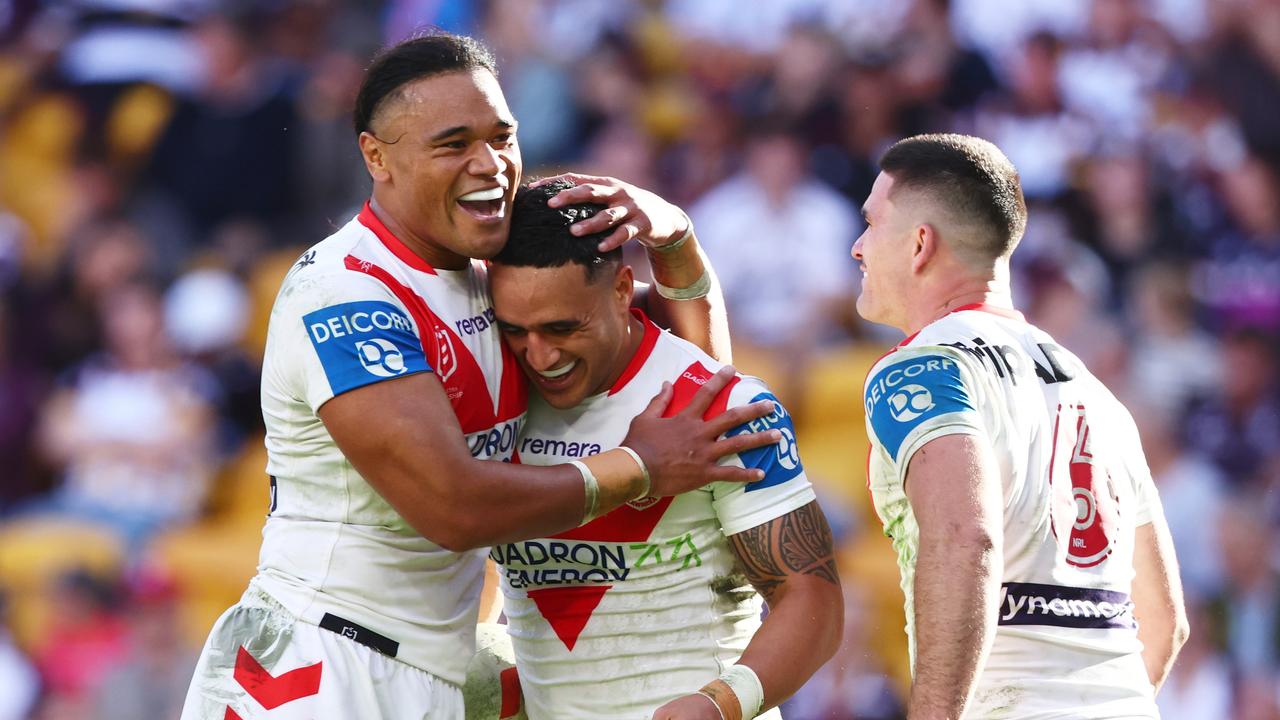 Dragons players celebrate.