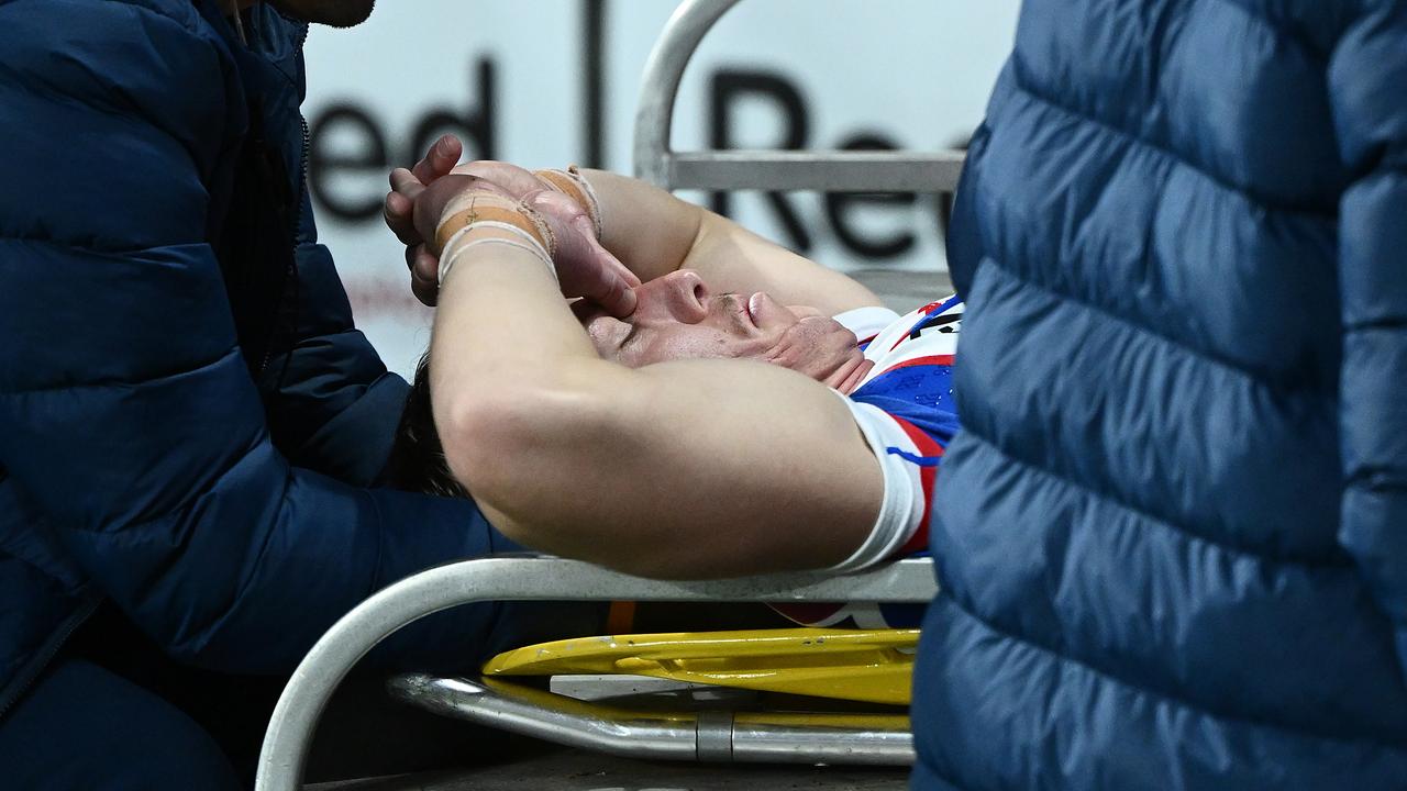 Phoenix Crossland of the Knights is stretchered from the field