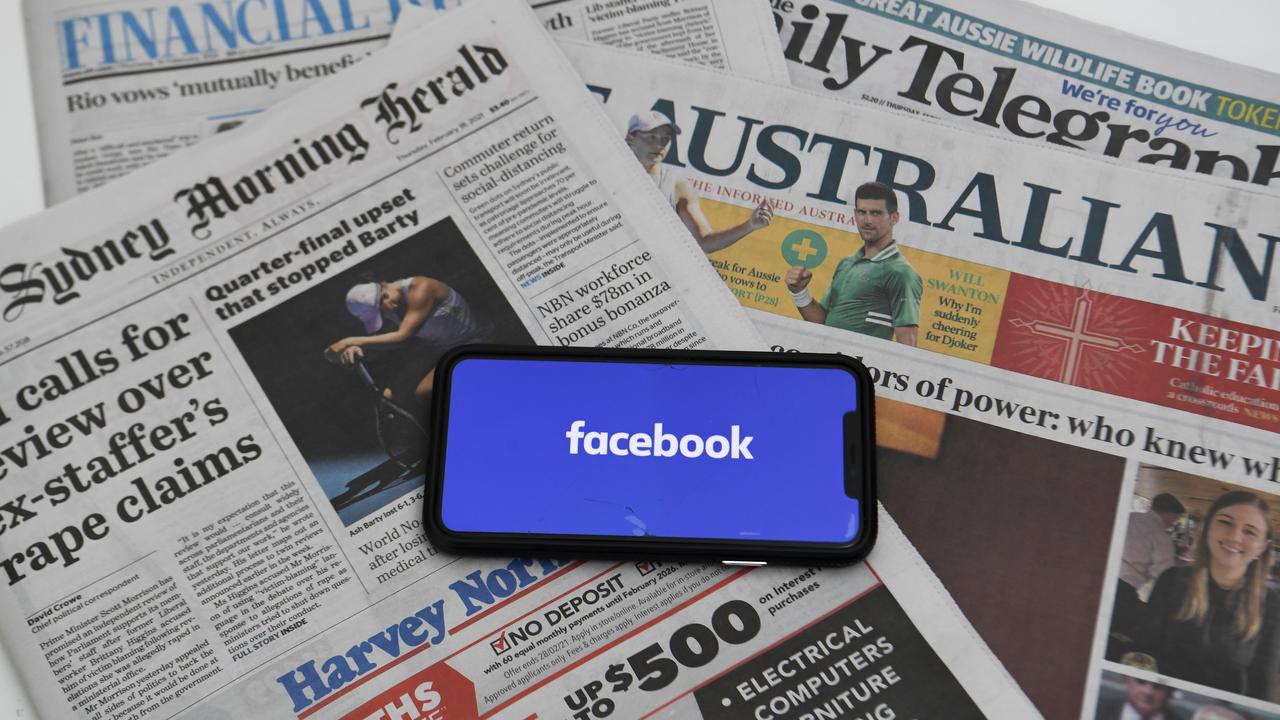 A mobile phone with newspapers