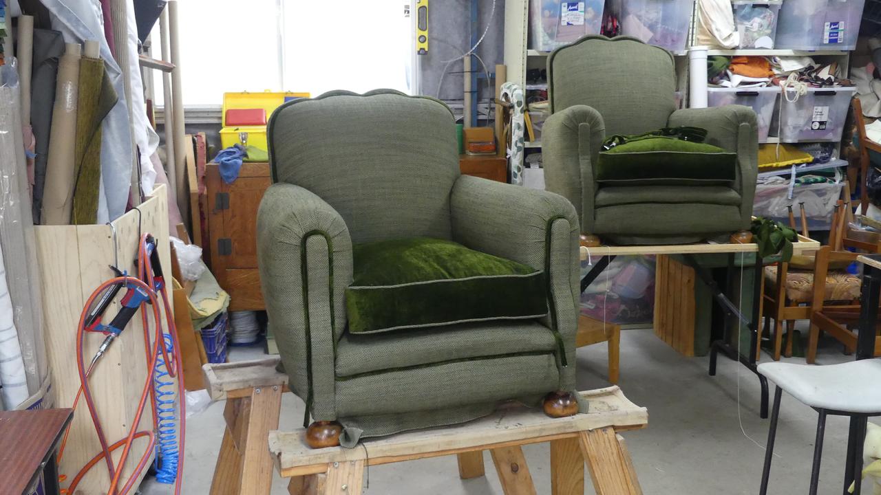 Two French-style armchairs being refurbished