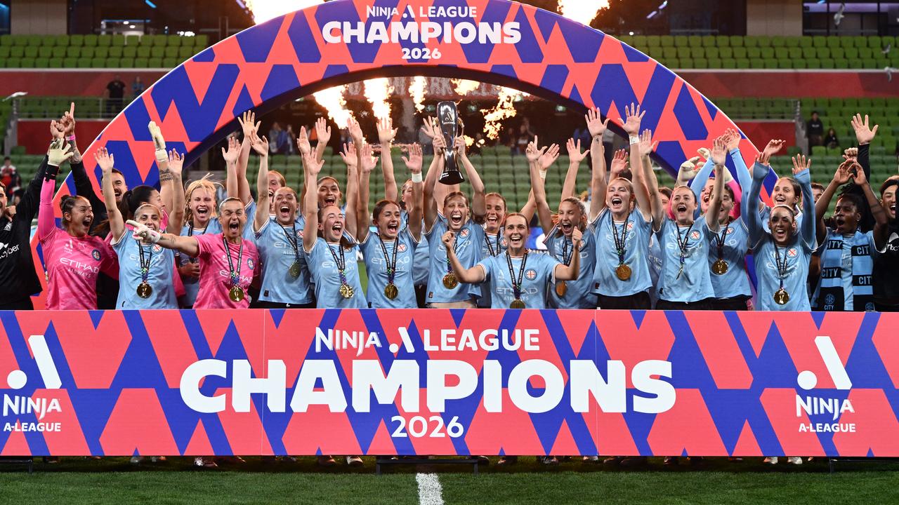 Melbourne City players and staff celebrate.
