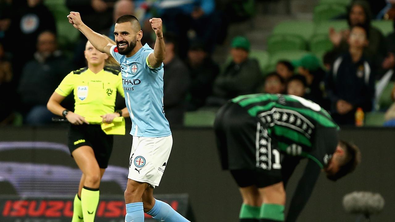 Aziz Behich of City celebrates 