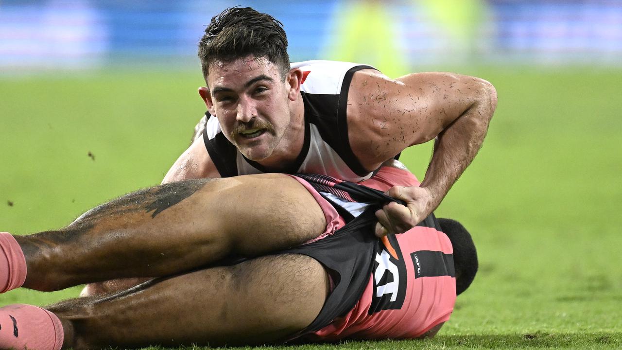 Hawthorn's Jai Newcombe put a cheeky tackle on the Suns' Touk Miller.