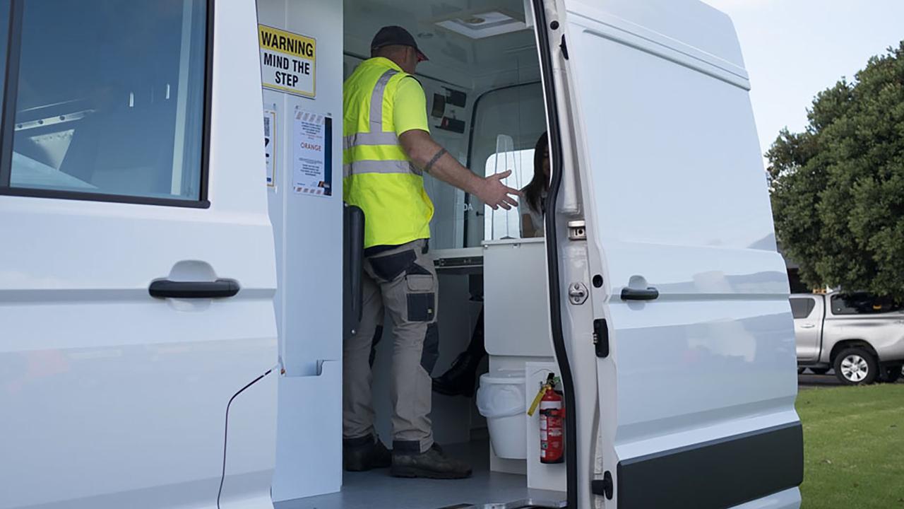 A worker in a drug testing van