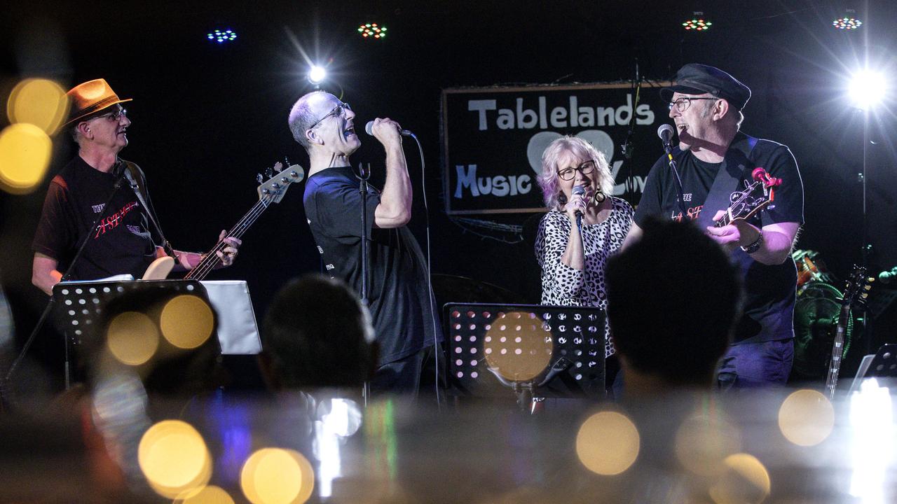 Dr Tony McLellan (far left) playing bass in the A-Street Band