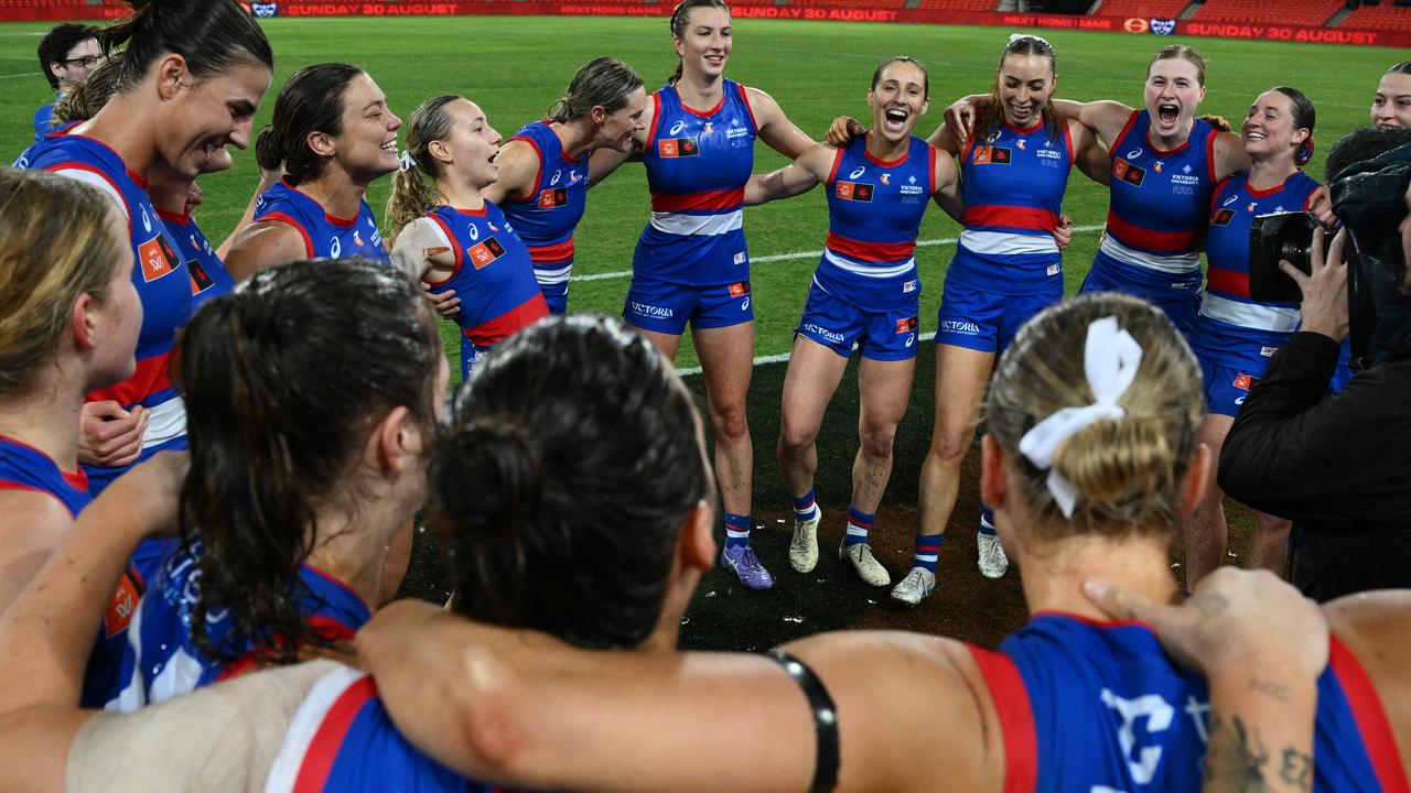 The Western Bulldogs celebrate their win over the Suns.